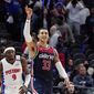 Washington Wizards forward Kyle Kuzma (33) reacts after hitting a 3-point basket in the closing seconds during overtime to defeat the Detroit Pistons in an NBA basketball game, Wednesday, Dec. 8, 2021, in Detroit. (AP Photo/Carlos Osorio)