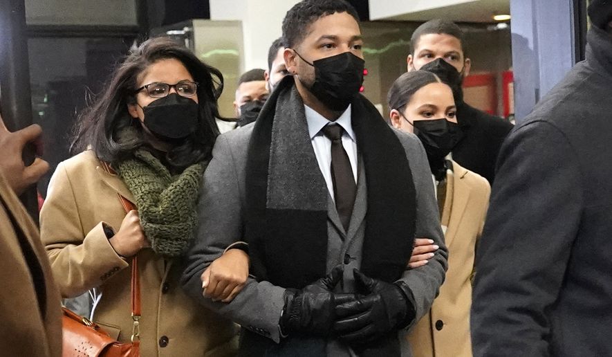 Actor Jussie Smollett, center, leaves the Leighton Criminal Courthouse with unidentified siblings, Thursday, Dec. 9, 2021, in Chicago, following a verdict in his trial. Smollett was convicted Thursday on five of six charges he staged an anti-gay, racist attack on himself nearly three years ago and then lied to Chicago police about it. (AP Photo/Nam Y. Huh)