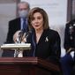 House Speaker Nancy Pelosi of Calif., speaks near the casket of former Sen. Bob Dole, who died on Sunday, during a congressional ceremony to honor Dole, who lies in state in the U.S. Capitol Rotunda in Washington, Thursday, Dec. 9, 2021. (Jonathan Ernst/Pool via AP) ** FILE **