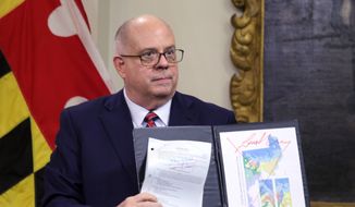 Maryland&#39;s Republican Gov. Larry Hogan shows a copy of the redrawn congressional map approved by the General Assembly this week, that is crossed out in red, during a news conference where he announced his veto of the plan in Annapolis on Thursday, Dec. 9, 2021. The General Assembly, which is controlled by Democrats, has the votes to override the governor&#39;s veto. (AP Photo/Brian Witte) **FILE**