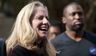 U.S. Rep. Abigail Spanberger, D-Va., smiles as she prepares to speak in Richmond, Va., Oct. 31, 2021. Draft maps for new congressional districts in Virginia would provide Democrats a strong chance to win six or seven of the states 11 seats, but they also draw Democratic Rep. Abigail Spanberger out of her Richmond-area district. (AP Photo/Steve Helber/FILE)