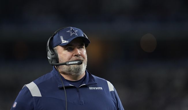 Dallas Cowboys head coach Mike McCarthy looks on at the sideline during an NFL football game against the Las Vegas Raiders, Nov. 25, 2021, in Arlington, Texas. McCarthy didn&#x27;t waste any time making his presence felt on his first day back with the team after a 10-day absence because of a positive COVID-19 test. At the end of a long answer about the Dallas offense Thursday, Dec. 9, 2021 going into Sunday&#x27;s visit to Washington, McCarthy lit up social media by saying the Cowboys would win the game. (AP Photo/Matt Patterson, file) **FILE**