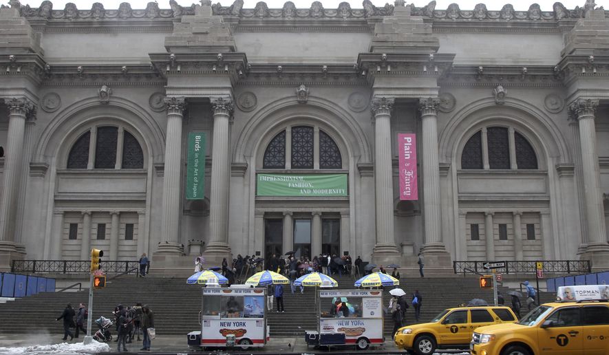 The exterior of the Metropolitan Museum of Art in New York appears on March 19, 2013. The Metropolitan Museum of Art is dropping the Sackler name from seven exhibition spaces amid growing outrage over the role the family may have played in the opioid crisis. (AP Photo/Mary Altaffer, File)