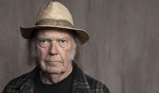 Neil Young poses for a portrait at Lost Planet Editorial in Santa Monica, Calif. on Sept. 9, 2019. Young had a barn rebuilt in the Rockies and used it to reunite with his old backing band Crazy Horse. The little log structure from the 1850s lends its name to the album that resulted, just called “Barn.” It will be released Friday along with a documentary of the same name directed by Young&#39;s wife Daryl Hannah. (Photo by Rebecca Cabage/Invision/AP, File)