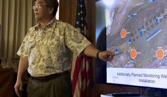 Honolulu Board of Water Supply chief engineer Ernest Lau points at a map during a meeting in Honolulu on July 27, 2016, to show where the Navy plans to build wells to monitor potential contamination from giant military fuel storage tanks. U.S. Sen. Brian Schatz said the EPA should step in after the Navy disputed the Hawaii Department of Health&#39;s analysis of fuel contamination at a well that provides drinking water to the Joint Base Pearl Harbor-Hickam&#39;s water system. Lau said the Navy informed the city agency on Wednesday, Dec. 8, 2021, that a high level of diesel fuel was found in samples of the Aiea-Hala­wa water shaft. (AP Photo/Audrey McAvoy, File)