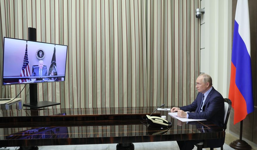 FILE - Russian President Vladimir Putin sits during his talk with U.S. President Joe Biden via video conference in the Bocharov Ruchei residence in the Black Sea resort of Sochi, Russia, Dec. 7, 2021. Biden warned Putin that Moscow would face &amp;quot;economic consequences like you&#39;ve never seen&amp;quot; if it invades Ukraine, although he noted that Washington would not deploy its military forces there. (Mikhail Metzel, Sputnik, Kremlin Pool Photo via AP, File)