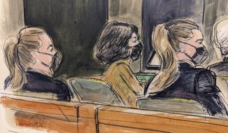 This courtroom sketch shows Ghislaine Maxwell, center, seated in court at the defense table between two U.S. Marshals seated in foreground, watching proceedings in her trial in New York, Friday Dec. 10, 2021. (AP Photo/Elizabeth Williams)
