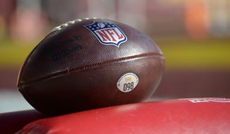 A Washington Football Team NFL football sits in the end zone prior to an NFL football game between the Dallas Cowboys and the Washington Football Team, Sunday, Dec. 12, 2021, in Landover, Md. (AP Photo/Mark Tenally)
