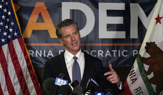 California Gov. Gavin Newsom addresses reporters after beating back the recall that aimed to remove him from office, at the John L. Burton California Democratic Party headquarters in Sacramento, Calif., Tuesday, Sept. 14, 2021. Newsom on Saturday, Dec. 11, pledged to empower private citizens to enforce a ban on the manufacture and sale assault weapons in the state, citing the same authority claimed by conservative lawmakers in Texas to outlaw most abortions once a heartbeat is detected. (AP Photo/Rich Pedroncelli, File)