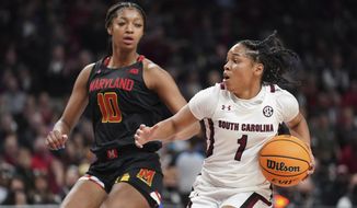South Carolina guard Zia Cooke (1) dribbles the ball against Maryland forward Angel Reese (10) during the second half of an NCAA college basketball game Sunday, Dec. 12, 2021, in Columbia, S.C. (AP Photo/Sean Rayford)