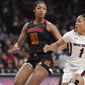 South Carolina guard Zia Cooke (1) dribbles the ball against Maryland forward Angel Reese (10) during the second half of an NCAA college basketball game Sunday, Dec. 12, 2021, in Columbia, S.C. (AP Photo/Sean Rayford)