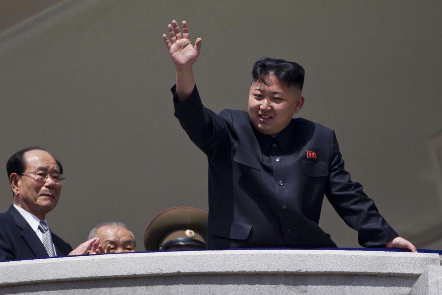 In this April 15, 2012, file photo, North Korean leader Kim Jong-un waves from a balcony at the end of a military parade at Kim Il-sung Square in Pyongyang, North Korea. Since taking power after his father's death in 2011, Kim has spent 10 years erasing doubts that he was too young and weak to extend his family’s brutal dynastic grip over the impoverished, nuclear-armed state. (AP Photo/David Guttenfelder, File)