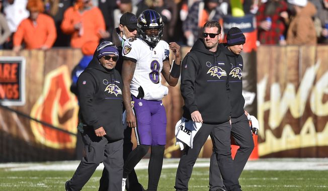 Baltimore Ravens quarterback Lamar Jackson (8) walks off the field with an injury during the first half of an NFL football game against the Cleveland Browns, Sunday, Dec. 12, 2021, in Cleveland. (AP Photo/David Richard) ** FILE**