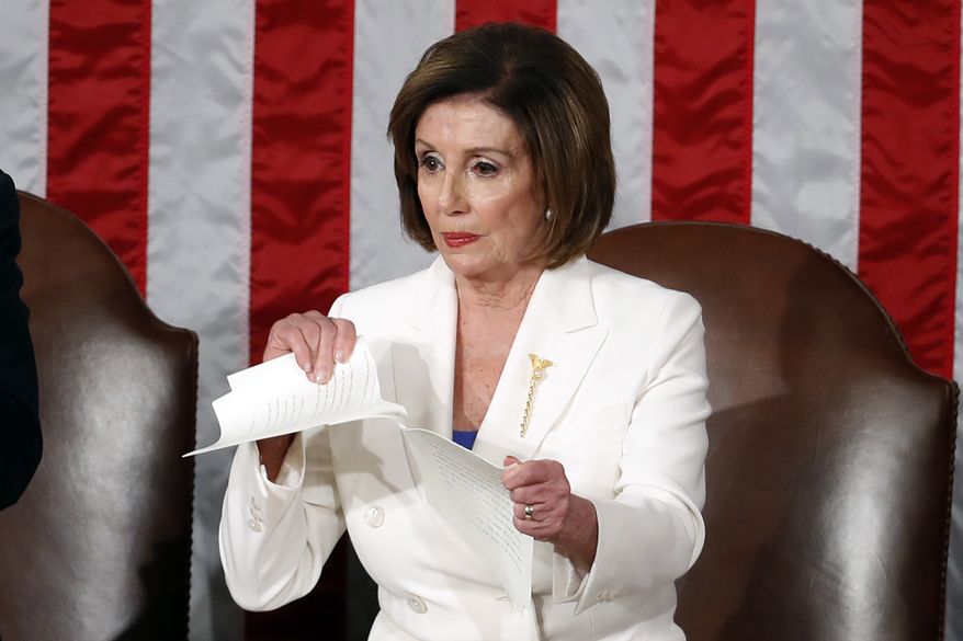 House Speaker Nancy Pelosi of Calif., tears her copy of President Donald Trump's State of the Union address after he delivered it to a joint session of Congress on Capitol Hill in Washington, Tuesday, Feb. 4, 2020. Vice President Mike Pence is at left. (AP Photo/Patrick Semansky)