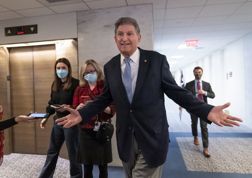 Sen. Joe Manchin, D-W.Va., leaves his office moments after speaking with President Joe Biden about his long-stalled domestic agenda, at the Capitol in Washington, Monday, Dec. 13, 2021. Manchin is a pivotal Democratic vote on passage of the president&#39;s top legislative priority. (AP Photo/J. Scott Applewhite)