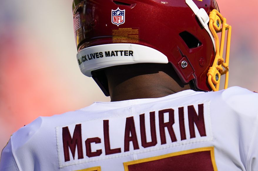 A message for Black Lives Matter is seen on the helmet of Washington Football Team wide receiver Terry McLaurin prior to an NFL football game against the Dallas Cowboys, Sunday, Dec. 12, 2021, in Landover, Md. (AP Photo/Julio Cortez)