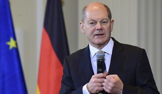 Outgoing Finance Minister and new German Chancellor Minister Olaf Scholz delivers a speech during the handing-over ceremony with his successor in the German Federal Ministry of Finances in Berlin, on December 9, 2021. (Tobias Schwarz?Pool Photo via AP)