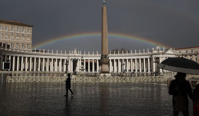 A rainbow shines over St.Peter&#x27;s Square at the Vatican, on Jan. 31, 2021. A Vatican official has apologized to a leading Catholic LGBTQ advocacy group for having yanked a reference to it on the Vatican website, saying he realized the move caused pain and that the Catholic Church indeed wants to include gays and hear from them. The Vatican’s General Secretariat for the Synod of Bishops, which is organizing a two-year consultation of rank-and-file Catholics ahead of a 2023 meeting of bishops at the Vatican, restored the reference to New Ways Ministries on the website over the weekend. (AP Photo/Alessandra Tarantino, File)