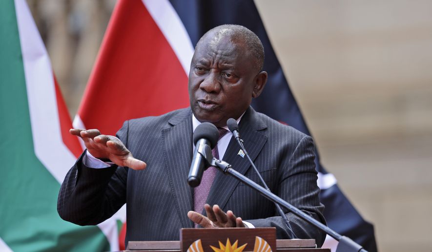 South African President Cyril Ramaphosa addresses the media after meeting with his Kenyan counterpart Uhuru Kenyatta in Pretoria, South Africa, Tuesday Nov. 23, 2021. Ramaphosa is receiving treatment for mild COVID-19 symptoms after testing positive for the disease, his office said Sunday, Dec. 12, 2021. (AP Photo/Themba Hadebe, File)
