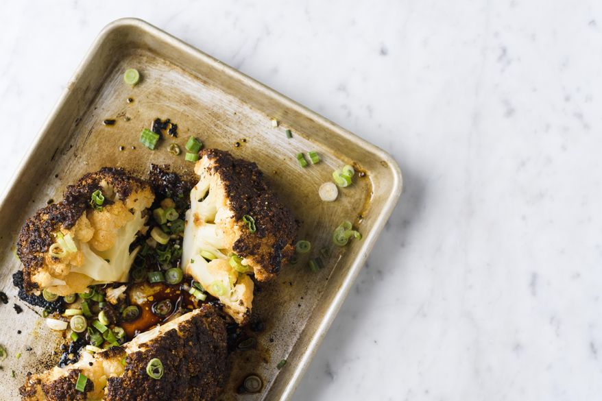 This image released by Milk Street shows a recipe for chili-garlic roasted whole cauliflower. (Milk Street via AP)