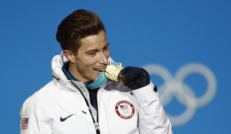 Men&#39;s halfpipe gold medalist Shaun White, of the United States, bites his medal during the medals ceremony at the 2018 Winter Olympics in Pyeongchang, South Korea, Wednesday, Feb. 14, 2018. As Shaun White embarked this month on the quest to make his fifth Olympics, the world’s most famous halfpipe rider finds living a life full of calculated risks is still part of his DNA. It&#39;s a mindset that is less taken for granted these days in all-or-nothing sports like his than it was a mere 12 months ago.  (AP Photo/Patrick Semansky, File) **FILE**