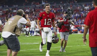 Tampa Bay Buccaneers quarterback Tom Brady (12) smiles as he leaves the field after a NFL football game against the Buffalo Bills, Sunday, Dec.12, 2021 in Tampa, Fla. (AP Photo/Alex Menendez)