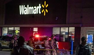 Police and SWAT team officers work the scene where shots were fired outside of a Walmart in the Waterworks shopping center, Tuesday, Dec. 14, 2021, in O&#39;Hara Township, Pa. (Alexandra Wimley/Pittsburgh Post-Gazette via AP)