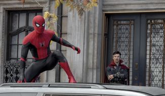 This image released by Sony Pictures shows Tom Holland, left, and Benedict Cumberbatch in Columbia Pictures&#39; &amp;quot;Spider-Man: No Way Home.&amp;quot; (Sony Pictures via AP)