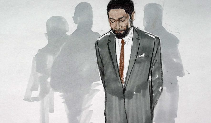 In this courtroom sketch, actor Jussie Smollett stands with his legal team in a Leighton Criminal Courthouse courtroom on Dec. 9, 2021, in Chicago, after a jury found him guilty on five of six charges he staged a racist, anti-gay attack on himself and lied to police about it. The lone Black juror on the panel that convicted Jussie Smollett of lying to police about what authorities say was a staged hate crime says he cannot get past how the actor put a noose around his neck when police were coming to interview him.  (AP Photo/Cheryl Cook, File)