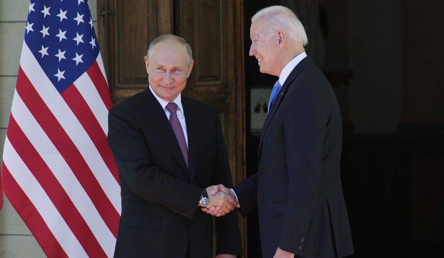 FILE - Russian President Vladimir Putin, left, and U.S President Joe Biden shake hands during their meeting at the &#x27;Villa la Grange&#x27; in Geneva, Switzerland in Geneva, Switzerland, Wednesday, June 16, 2021. Biden warned Putin of &amp;quot;severe consequences&amp;quot; if Russia invades Ukraine, but promised to hold consultations to address Russian concerns. (AP Photo/Alexander Zemlianichenko, Pool, File)