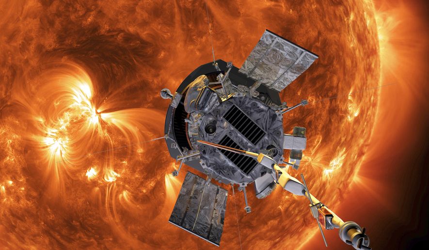 This image made available by NASA shows an artist&#39;s rendering of the Parker Solar Probe approaching the Sun. On Tuesday, Dec. 14, 2021, NASA announced that the spacecraft has plunged through the unexplored solar atmosphere known as the corona in April, and will keep drawing ever closer to the sun and diving deeper into the corona. (Steve Gribben/Johns Hopkins APL/NASA via AP)