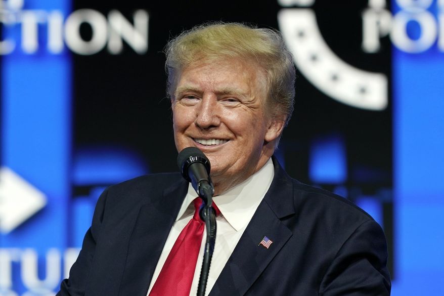 Former President Donald Trump smiles during a Turning Point Action gathering in Phoenix in July. Trump's new social media company forecasts it may have 81 million users by 2026, or nearly 7 million more people than voted for him in the last U.S. presidential election. The projection was filed on Monday, Dec. 6, 2021 with securities regulators by the company trying to bring Trump Media & Technology Group to the stock market. (AP Photo/Ross D. Franklin, File)