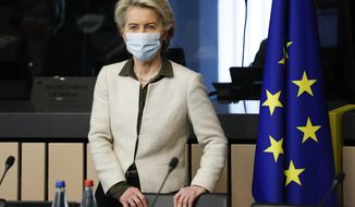 European Commission President Ursula von der Leyen arrives for a meeting of the College of Commissioners, in Strasbourg, France, Tuesday, Dec. 14 2021. The College will discuss on a comprehensive package on energy and climate action and will also adopt a proposal for a revision of the Schengen Borders Code. (Julien Warnand, Pool Photo via AP)