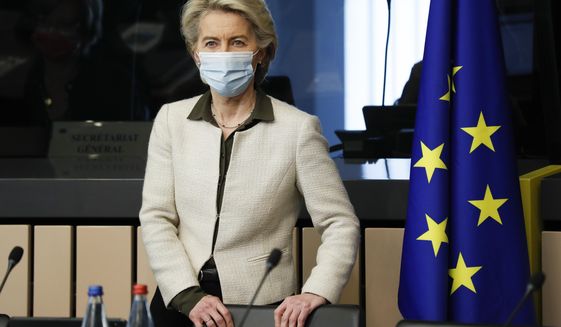 European Commission President Ursula von der Leyen arrives for a meeting of the College of Commissioners, in Strasbourg, France, Tuesday, Dec. 14 2021. The College will discuss on a comprehensive package on energy and climate action and will also adopt a proposal for a revision of the Schengen Borders Code. (Julien Warnand, Pool Photo via AP)