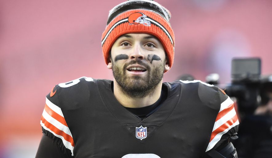 Cleveland Browns quarterback Baker Mayfield walks off the field after his team defeated the Baltimore Ravens in an NFL football game, Sunday, Dec. 12, 2021, in Cleveland. (AP Photo/David Richard)