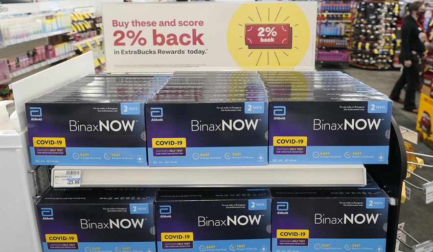 Boxes of BinaxNow home COVID-19 tests made by Abbott are shown for sale on Nov. 15, 2021, at a CVS store in Lakewood, Wash. The Biden administration&#39;s plan for health insurers to reimburse consumers for over-the-counter COVID-19 tests is recalling the model of a bygone era when the companies processed large volumes of claims from individuals _ with paper receipts. (AP Photo/Ted S. Warren) **FILE**