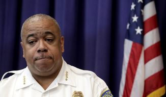 Baltimore Police Commissioner Michael Harrison speaks during a news conference Tuesday, July 23, 2019, in Baltimore. Police say a Baltimore officer is in critical condition after being ambushed and shot while sitting in a patrol vehicle. Harrison says on Thursday, Dec. 16, 2021,  the officer was on-duty but not responding to a call around 1:30 a.m. when the shooter approached from behind and opened fire.  (AP Photo/Julio Cortez, File)