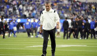 FILE - Jacksonville Jaguars head coach Urban Meyer walks off the field after a loss to the Los Angeles Rams during an NFL football game Sunday, Dec. 5, 2021, in Inglewood, Calif.  Urban Meyer&#39;s tumultuous NFL tenure ended after just 13 games — and two victories — when the Jacksonville Jaguars fired him early Thursday, Dec. 16, 2021 because of an accumulation of missteps. (AP Photo/Jae C. Hong, File)