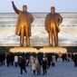 Citizens visit the bronze statues of their late leaders Kim Il-sung, left, and Kim Jong-il on Mansu Hill in Pyongyang, North Korea Thursday, Dec. 16, 2021, on the occasion of 10th anniversary of the demise of Kim Jong-il. (AP Photo/Cha Song Ho)