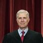 Associate Justice Neil Gorsuch stands during a group photo at the Supreme Court in Washington, April 23, 2021. (Erin Schaff/The New York Times via AP, Pool, File)