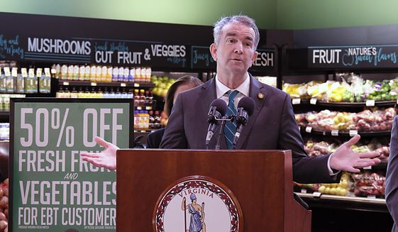 Virginia Gov. Ralph Northam announces his upcoming budget proposal during a news conference inside The Market at 25th in Richmond, Va., on Tuesday, Dec. 14, 2021. (Bob Brown/Richmond Times-Dispatch via AP) ** FILE **