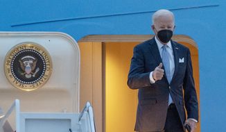 President Joe Biden gestures as he board Air Force One en route to South Carolina State University&#39;s 2021 Fall Commencement Ceremony, Friday, Dec. 17, 2021, at Andrews Air Force Base, Md. (AP Photo/Gemunu Amarasinghe)