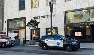 Police officers and emergency crews park outside the Louis Vuitton store in San Francisco&#39;s Union Square on Nov. 21, 2021, after looters ransacked businesses. Stung by recent headline-grabbing smash-and-grab robberies at high-end stores, California Gov. Gavin Newsom said Friday, Dec. 17, 2021, that he will seek more than $300 million over three years to boost law enforcement efforts on retail theft, while he also is targeting increasing gun violence. (Danielle Echeverria/San Francisco Chronicle via AP) **FILE**