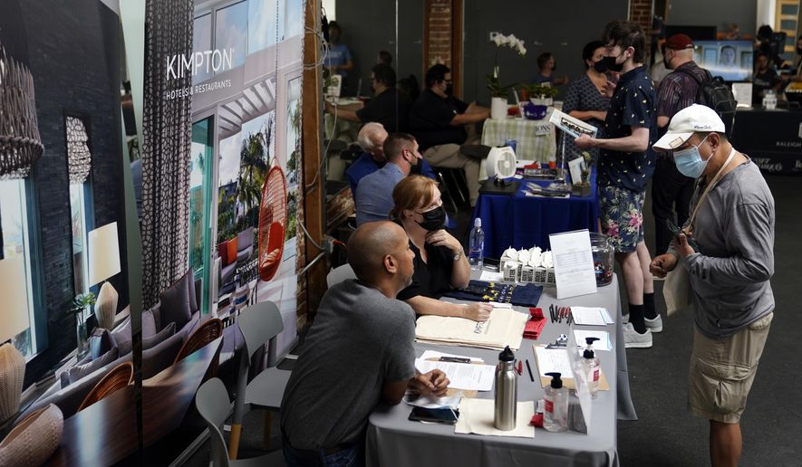 Prospective employers and job seekers interact during during a job fair on Sept. 22, 2021, in the West Hollywood section of Los Angeles. (AP Photo/Marcio Jose Sanchez, File)