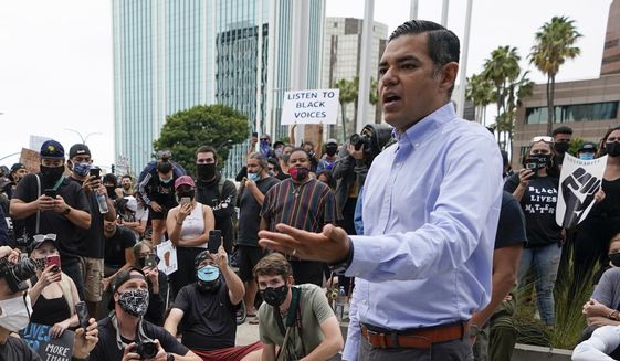 Robert Garcia, the then-mayor of Long Beach, Calif., speaks to demonstrators outside Long Beach City Hall on June 4, 2020, in Long Beach, Calif., during a protest over police brutality and the death of George Floyd. Garcia launched his campaign for the U.S. House on Friday, Dec. 17, 2021, a day after long-serving Democratic Rep. Alan Lowenthal announced he would retire at the end of his term. (AP Photo/Ashley Landis, File)