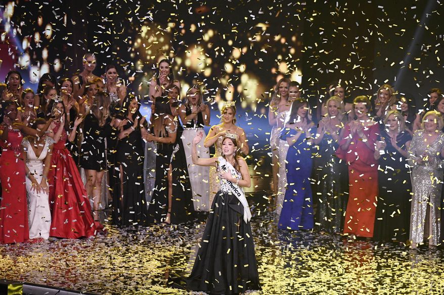 Miss Alaska Emma Broyles waves in confetti after being crowned Miss America, Thursday, Dec. 16, 2021, at Mohegan Sun in Uncasville, Conn. (AP Photo/Jessica Hill)