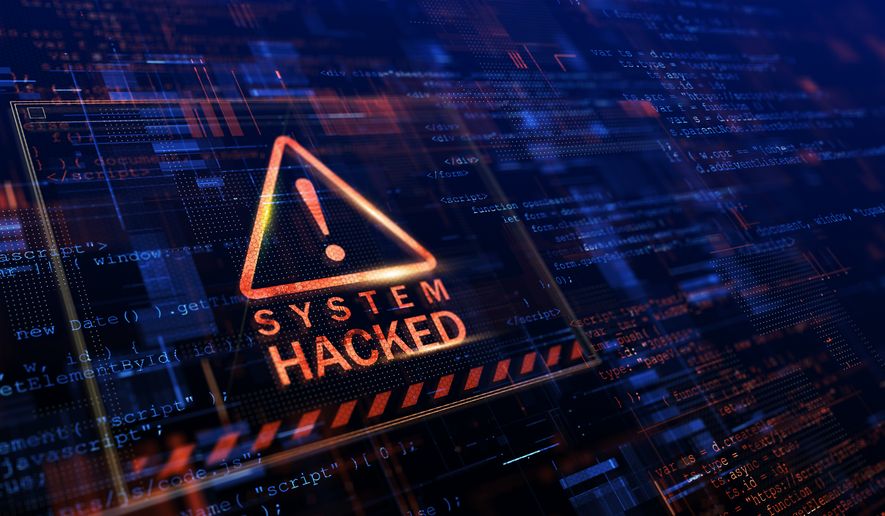 Warning of a system hacked. Photo credit: Sashkin via Shutterstock. FILE