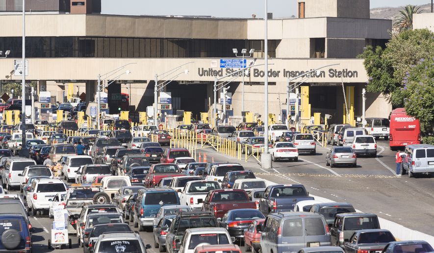 San Ysidro, California, USA - 15 November 2006: Vehicles lined up for US immigration and customs processing at the border entry point from Tijuana. Arthur Greenberg via Shutterstock. FILE