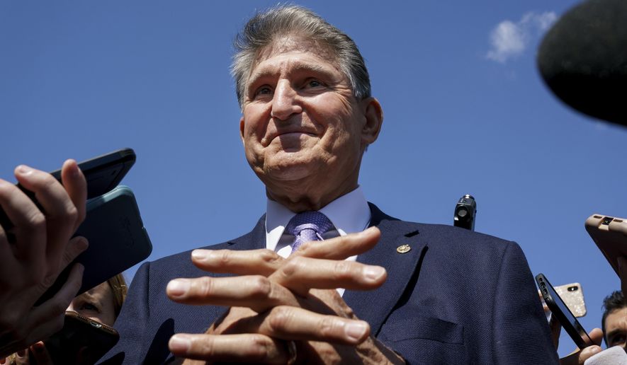 Sen. Joe Manchin, D-W.Va., a centrist Democrat vital to the fate of President Joe Biden&#x27;s $3.5 government overhaul, updates reporters about his position on the bill, at the Capitol in Washington, Thursday, Sept. 30, 2021. (AP Photo/J. Scott Applewhite) **FILE**