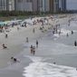 Beachgoers line the sand Thursday, July 9, 2020, in Myrtle Beach, S.C. (AP Photo/Chris Carlson, File)